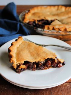 a piece of pie on a plate with a fork