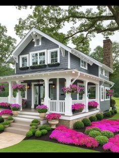 a house with flowers in the front yard