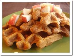 waffles with apple slices on a green plate