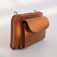 This elegant, genuine Italian leather wallet comes with straps and is the perfect everyday purse. It holds all of your essentials, is cute, and goes with phone pocket. DETAILS:  .: Genuine leather wallet bag  .: Strap included   .: Made in Italy  .: Hand made  .: Strap is adjustable from 23 to 45 inches.  Dimensions 8x4 inch , it's enough space for money, cards, mobile phone. SHIPPING .: Once your order is placed, you can expect your package will be shipped within 1-3 business days  .: Our store is located in Texas, and all items are shipped out of Texas CARE: .: To keep your wallet lasting longer treat it like your skin.) You can wash it, but do not overdry with soap.  Do not machine wash or tumble dry. Anyway natural skin is always strong and durable. MORE: Return: You can make a return Versatile Brown Wallet With Mobile Phone Bag, Versatile Brown Phone Bag With Interior Card Slots, Brown Wallets With Mobile Phone Bag For Everyday, Classic Wallet With Mobile Phone Pouch, Brown Wallets With Mobile Phone Bag, Leather Wallet On Chain For Travel, Brown Phone Bag With Card Slots For Everyday Use, Everyday Brown Wallet With Mobile Phone Bag, Daily Use Mobile Phone Wallet Clutch