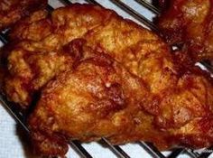 some fried food sitting on top of a metal rack