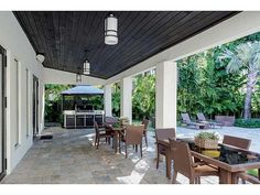 an outdoor dining area with tables and chairs