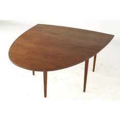 an oval shaped wooden table with two legs