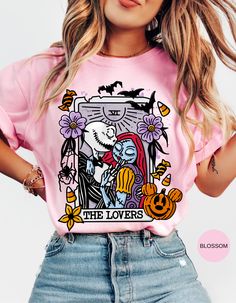 a woman wearing a pink t - shirt with an image of the lovers on it