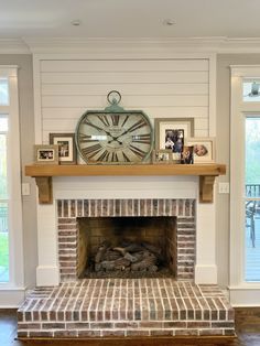 a fireplace with a large clock above it