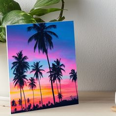 a painting of palm trees at sunset with pink and blue sky in the background art board print