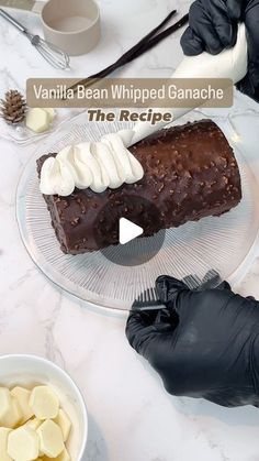 a chocolate cake with whipped cream on top and other desserts in bowls around it