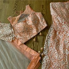 Size 36-38. Semi Net, Peach Lengha. Threadwork And Gold Sparkle All Over. There Are Also Rhinestones Encased In A Gold Metal Scattered Throughout. Attachable, Long Sleeves Included. Elegant Lace Work Sets For Navratri, Lace Work Sets For Diwali Reception, Elegant Orange Sets For Navratri, Elegant Net Sets For Festivals, Peach Fitted Sharara For Diwali, Fitted Peach Sharara For Diwali, Traditional Peach Fitted Sets, Traditional Fitted Peach Set, Elegant Peach Sets For Festive Season