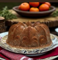 a bundt cake sitting on top of a plate next to other plates and bowls