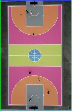 an overhead view of a basketball court with people playing