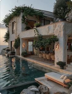 a house with a swimming pool in front of it and plants growing on the wall