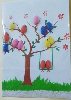 a tree with birds painted on the branches