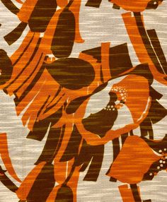 an orange and brown pattern on fabric