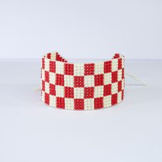 Red and white checkered board beaded bracelet. Completely handmade with red and ivory matte glass seed beads. Made to order, neatly woven bead by bead.  This bracelet is also available in luster (not matte) beads.  Bracelet Details ❋ Beaded Length: 6 in. Bracelet Width: 1 in. Made with an adjustable slide closure, that ensures it'll fit all wrists.  Please visit our Etsy shop, to shop an array of beaded and woven bracelets:  www.etsy.com/shop/CUYAARTESANIA This pattern is original to CUYÀ, feel Checkered Board, Boho Handmade, Custom Bracelet, Loom Pattern, Seed Bead Bracelet, Woven Bracelet, Bead Loom Bracelets, Woven Bracelets, Bracelet Cuff