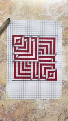 a piece of paper that has been cut into some type of maze on top of it