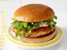 a chicken burger with lettuce on a plate