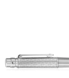 a fountain pen with an intricate design on the body and nib cap is shown in front of a white background