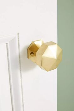 an open door with a gold knob on it