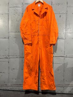 Orange Jumpsuit Prison, Retro Workwear Overalls, Retro Long Sleeve Overalls For Work, Vintage Long Sleeve Jumpsuit For Work, Vintage Long Sleeve Jumpsuits And Rompers For Work, Vintage Overalls For Workwear, Vintage Denim Overalls For Work, Vintage Cotton Jumpsuits And Rompers For Work