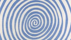 a blue and white background with an abstract spiral design in the center, as if it was made out of paper