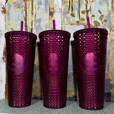 three purple tumblers sitting next to each other