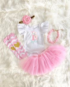 ♥ Personalized Ballerina First Birthday Tutu Outfit ♥This sweet Ballerina First Birthday Tutu Outfit is sure to be a special addition to your little one's first birthday. Bodysuit has 3 snap closure and expandable shoulders, 100% cotton. Leg warmers are soft and stretchy. Keep your little one warm and stylish! Also perfect for protecting knees for crawling babies. Adorable chevron pattern with gold glitter hearts. Necklace is adjustable. Never leave babies left unattended with necklace. These bo Cute White First Birthday Sets, Playful White Sets For First Birthday, Pink Princess Sets For Birthday, Pink Princess Birthday Sets, Pink First Birthday Sets For Spring, Pink Sets For First Birthday In Spring, Cute Pink First Birthday Sets, Personalized Cute Sets For First Birthday, White Princess Sets For First Birthday