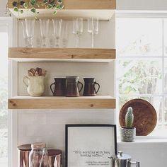 there is a shelf with wine glasses on it