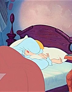 an animated character sleeping in bed next to a cat