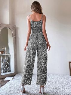 This printed, stylish Ditsy Floral Tie Front Shirred Waist Cami Jumpsuit is perfect for any occasion. The high waist and regular fit provide a flattering silhouette that's both comfortable and stylish. Crafted from a non-stretch fabric, this top is made of 100% polyester, making it lightweight and breathable. The spaghetti straps make it easy to adjust the fit, and the sleeveless design is perfect for summer days. Elevate any look with this versatile top. Specifications: Details: Shirred, Tie Front Neckline: Spaghetti Strap Sleeve Length: Sleeveless Waist Line: High Waist Fit Type: Regular Fit Fabric: Non-Stretch Material: Fabric Composition: 100% Polyester Care Instructions: Machine wash or professional dry clean Product Measurements(cm): Size US Bust Hip Size Length Thigh Waist Size XS 2 Sleeveless Floral Print Jumpsuits, Sleeveless Non-stretch Floral Jumpsuits And Rompers, Casual Floral Print V-neck Jumpsuits And Rompers, Casual Sleeveless Floral Print Jumpsuits And Rompers, Printed Jumpsuits And Rompers For Beach, Non-stretch Floral Jumpsuits And Rompers For Vacation, Casual Printed Patterned Jumpsuits And Rompers, Patterned Sleeveless Jumpsuits And Rompers For Spring, Casual Floral Print Jumpsuit For Day Out