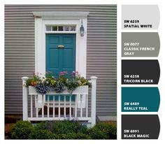 the color scheme for this house is blue, green, and gray with white trim