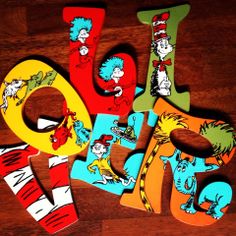 dr seuss and the cat in the hat cut out letters on a wooden table