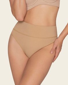 This shaper thong panty is the perfect combo between compression and coverage. Moderate compression in the mid-to-lower tummy shapes your silhouette comfortably. Made of our super soft seamless SkinFuse® fabric for a second skin feel. Its double-layered waistband and flexible boning keep it in place and accentuate your curves. Supportive Seamless Full Coverage Shapewear, Supportive Full Coverage Seamless Shapewear, High Stretch No-show Shapewear With Built-in Bra, Supportive No-show Shaping Shapewear, Seamless Compressive Full Coverage Shapewear, High Stretch No-show Shapewear, Seamless No-show Shapewear, Supportive Stretch Shapewear With Seamless Construction, Supportive Micro-elastic Solid Shapewear