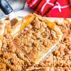 a close up of a spoonful of apple crisper pie