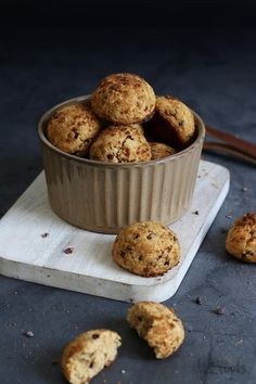 a bowl filled with cookies sitting on top of a table