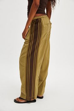 Find FREE PEOPLE Hudson Canyon Side Printed Pants on Editorialist. A cool cotton pair, these slouchy pants are featured in a high-rise fit and wide-leg style with side striped detailing and drawstring waistband. **Fit:** High-rise; wide, full-length legs **Features:** Soft cotton fabrication with sporty side striping, adjustable drawstring waistband, pockets for hands, back-pocket detail **Why We ❤ It:** These billowy pants pair perfectly with your favorite tank and strappy sandals. Hudson Canyo Slouchy Pants, Cozy Pants, Boho Pants, Comfy Sweaters, Hottest Fashion Trends, Tomboy Fashion, Refashion Clothes, Side Stripe, Bottom Clothes