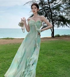 Indulge in ethereal elegance with the Oceana Dress. The flowy, waterfall design embodies the whimsical spirit of fairycore fashion aesthetic. Perfect for romantic picnics at the beach or enchanting garden parties, this dress will make you feel like a fairy princess. Don't just dream, live your fairytale now! Size S bust 80cm waist 68cm length 137cm Size M bust 84cm waist 72cm length 137cm Size L bust 88cm waist 76cm length 137cm Fairycore Dress For Garden Party, Fairycore Ruffled Fairy Dress For Garden Party, Fairycore Fairy Dress With Ruffles For Garden Party, Fairycore Fairy Dress With Ruffles For Party, Ethereal Ruffled Dress For Party, Fairycore Ruffled Fairy Dress For Spring, Spring Fairycore Dress With Ruffles, Spring Fairycore Fairy Dress With Ruffles, Whimsical Fairy Dress With Ruffles For Garden Party