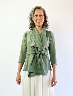 The Cocoon Jacket is the perfect grab-and-go jacket when you need an extra layer. A year-round layering design with sophisticated and effortless drape. This jacket is excellent for travel and is sure to become a staple garment. Belted – Ties attached at the side seams made from Lycra blended fabric for extra stretch. Size - Order based on your BUST measurement Fabric Shown - Heavy Hemp/Organic Cotton Knit, Light Hemp/Organic Cotton Knit, Stretch Organic Cotton Knit, NC Grown Organic Cotton Knit Versatile Spring Wrap Outerwear, Versatile Wrap Outerwear For Layering, Spring Layering Outerwear In Lagenlook Style, Layering Design, Cocoon Jackets, Above Elbow, Belted Jacket, Fabric Bolts, Elbow Sleeve