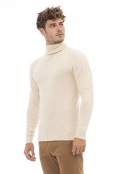 Indulge in the epitome of sophistication with Alpha Studio’s Turtleneck Sweater, a testament to refined style and comfort. Crafted with a luxurious blend that includes alpaca leather and soft cotton, this suave beige sweater is designed to make a statement while keeping you cozy. Its fine ribbed collar, cuffs, and bottom hem ensure a perfect fit and enduring quality. Perfect for the modern connoisseur who appreciates a touch of Italian elegance in their wardrobe. Material: 40% Alpaca Leather, 3% Beige Turtleneck, Italian Elegance, Embroidery Shoes, Beige Sweater, Jordan 1 Retro High, Studio S, Premium Brands, Sweater Sleeves, Modern Man