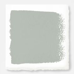 a white square with some gray paint on it's side and the color is light green