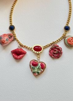 Ceramic lovely necklace, heart pendants. Charm mug, heart, roses and lips. Painted with underglaze, glaze and 11k gold luster. Birtday gift, christmas gift, gift for her and yourself. can where it everyday, special festivals and occasions. 11k gold luster and stainless steel necklace Heart Roses, Necklace With Charms, Heart Pendants, Ceramic Necklace, Necklace Heart, Everyday Necklace, Lovely Necklace, Steel Necklace, Stainless Steel Necklace