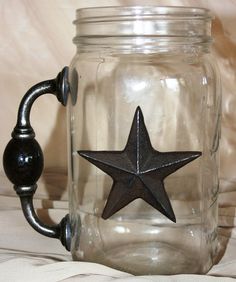 a glass jar with a metal star on it