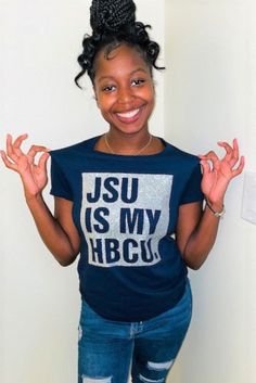 a woman standing in front of a white wall with her hands up and the words jsu is my hbcu on it