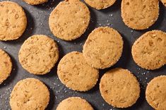 some cookies are sitting on a baking sheet and ready to be baked in the oven