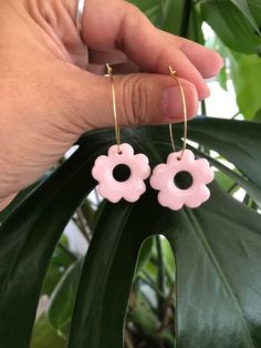 Lightweight earrings, that come in a beautiful light pink shade.   Made with polymer clay topped off with resin on a gold hoop.   Each pair of earrings are hand made so there might be some special distinctions on them. They all come with their own personalities or character if you will. They are all unique in their own way, therefore there are no 2 that are exactly the same.  Care instructions -  Store in a clean dry area.  Do not wear in water.  You may clean your earrings with a soft damp towe Handmade Pink Flower Drop Earrings, Handmade Pink Jewelry For Everyday Wear, Handmade Pink Everyday Jewelry, Handmade Pink Dangle Flower Earrings, Pink Dangle Flower Earrings For Gift, Pink Dangle Flower Earrings Gift, Cute Everyday Pierced Earrings, Trendy Pink Flower Drop Earrings, Pink Flower Shaped Single Earring