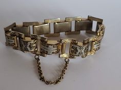 "Measures Approx. 7 1/2\" long x 5/8\" wide Previously Owned Condition. Does have wear to finish on the back of bracelet. NOTE: This style the safety clasp did not come apart, it is connected to the bracelet on both ends. See photos. My items are previously owned or vintage items. As with most previously owned items they may have light surface scratches or very light wear. PLEASE NOTE: Due to the exorbitant fees attached to selling online, any sale item purchased through Etsy Marketing program maybe canceled and refunded. If you are unfamiliar with Etsy Marketing please read Etsy's site.  Sorry for any inconvenience this may cause." Adjustable Chain Bracelet With Box Clasp, Vintage Chain Link Metal Bracelets, Vintage Link Bracelet With Clasp, Vintage Metal Bracelets With Chain Link, Vintage Adjustable Bracelets With Box Clasp, Vintage Engraved Chain Link Bracelet, Vintage Engraved Chain Link Bracelets, Vintage Engraved Link Bracelets, Adjustable Vintage Bracelets With Box Clasp