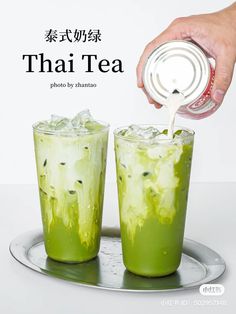 there is a person pouring tea into two glasses on a tray with the words, thai tea