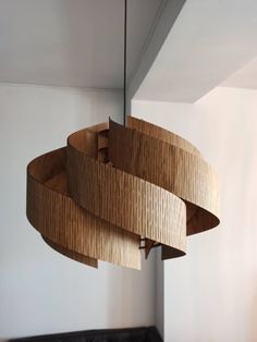 a wooden light fixture hanging from the ceiling