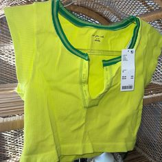 Nwt Urban Outfitters Out From Under Seamless Crop Brand New With Tags Color: Neon Yellow + Green Size : Xl Runs Small In My Opinion Cheap Multicolor Tops From Urban Outfitters, Affordable Yellow Tops From Urban Outfitters, Spring Stretch Lime Green Top, Casual Yellow Seamless Tops, Green Stretch Summer Crop Top, Green Stretch Crop Top For Summer, Summer Stretch Green Crop Top, Casual Cropped Yellow Tank Top, Urban Outfitters Seamless Summer Crop Top