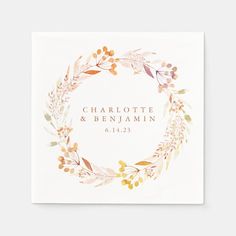 a wedding card with watercolor leaves and berries on it, in white paper that says charlotte & benjamin