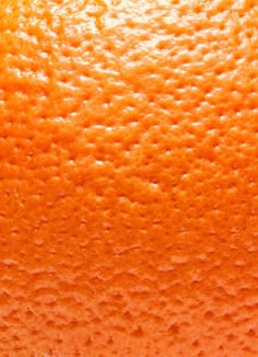 an orange is shown close up on the surface